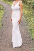 We had a more casual wedding reception in August to celebrate our marriage. I ordered this dress as a second dress to wear... it was absolutely stunning. Fits like a glove, hugs all the right places. Be prepared to not wear any undergarments, however. I got a lot of compliments and it photographs well too. I did have to get the bottom hemmed. Overall, very pleased!!! - Brittany B.
