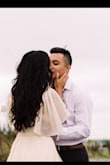 Go ahead and try this one. Very womanly, very flattering. Still works with most normal bras. Mine didn't peek much. Used for our engagement photos. I think they came out lovely. Would size down next time. - Carly C.
