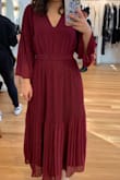 I loved this dress, I wore it to a winter wedding and since I am on the shorter side, it was a maxi dress on me but I could still show off my heels. I got so many compliments on it. I wore the bow to the back as it looked better. - Melinda L.