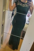 The fit is very snug (borderline tight) ontop and form fitting (with a bit of stretch) on bottom. The fabric is very thick (perfect for winter weddings or cold events) and will keep you warm. A word of warning: the zipper is incredibly finicky, to the point where I thought the dress might have been too small because we couldn't get it to budge. The length was a few inches too long, but wearing a 3.75in heel made it perfect. - Nicole K.