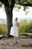 A lot of customers said they cut out the tulle, but I left it in. I felt it sort of made me look heavier, but then sometimes I liked the fullness of the skirt. My makeup artist said it looked better with the tulle in. I am normally a dress size 10 (M), but glad I got a large 10/12. The bodice fit great. I loved the tea length for my wedding. I actually had a $800+ dress and returned for this one ($90 w/ coupon!) Great deal and super cute. My favorite aspects were the scalloped lace and pockets! - Sarah W.