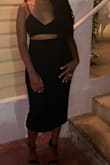 Fabric and color are very forgiving. Material is thick enough to wear during colder months with a jacket. Sexy but not super revealing. Wore to a dinner with friends. Purchased in red too! - Chanel B.