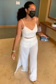 White is definitely not my color, but I went to a friends all white destination wedding and wore this outfit. Very flattering. Loved it so much, I purchased it in black. The only thing I didn't like was the lining. The pants are see through so there is white lining to prevent this. However the lining makes it look like you have a pair of white shorts on underneath. Didn't bother me enough to send back and I was probably the only one that noticed. Overall very cute! - Chanel B.