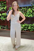 I wore this jumpsuit for my wedding rehearsal dinner. The champagne color was elegant and it was incredibly comfortable. I got so many compliments!  It was easy to steam the wrinkles out. I definitely needed heels which I anticipated based on my height. - Lauren F.