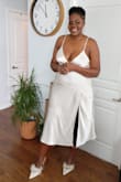 The hand of the fabric is so soft and the dress is very comfortable.

Even for a tall person the slit wasn't scandalous. I have other Lulus dresses in XL and they are a perfect fit. This one runs a bit small. Would exchange for a size up but it only goes up to XL.

I did add double sided tape on my chest to avoid a nip slip as the models chest isn't as busty as mine. - Chanda C.