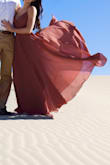 I bought this dress for my engagement pictures and omg it's amazing. There's so much extra material that it's so flowy! It's also pretty comfortable which is a plus and the color is amazing. - Hope R.