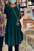 This is my first Lulus purchase and I liked the dress so much I ordered TWO one in Hunter Green and one in Purple. The Hunter Green absolutely pops on camera...and they're both so comfy but also playful and sexy and easy to wear. Just throw over tights or leggings or boots, add a necklace and you're set. I know I'll get a lot of wear over fall and winter. Very pleased with quality for the price. - Carrie S.
