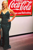 I wore this dress to a friend's wedding and got several compliments. The material has some stretch so it was very comfortable but I wouldn't say it's "forgiving" (in the tummy area). Even with my tallest heels, the front of the dress was too long. I had to hold it up while I walked or else I would trip. I ended up ripping the bottom seam (near the near) by stepping on it while tipsy and dancing! My seamstress should be able to fix it. My only complaints other than the length are
1- when it arrived, it has some loose threads I had to cut off or else they would have gotten worse, 2- totally had a nip slip before I left the house. I tied it as tight as I could but my girls were on the verge of falling out all night. The string was cutting into my back fat but I'd rather have that than a wardrobe malfunction. - Heather T.