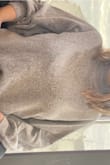 I love this sweater!! It's so soft and cute and I adore the color. It does run large so I can't really wear it without at least partially tucking it into my pants but I think it's super cute still! If you are okay with looser and needing to tuck, order in your size. It's a little long so even if you size down (which you should if you need more form fitting) you still might need to tuck. The turtleneck portion is perfect and not tight at all! I definitely don't regret this purchase and have already worn it twice since it arrived! Sorry the photo isn't amazing but I'm at work lol! Hope it's somewhat helpful. - Molly G.