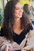 Love this sweater and it's a great fall transition piece. Not too warm, but warm enough you can still sit outside for brunch! This is knit and will get caught on anything pointy or sticking out so be careful! - Caroline G.