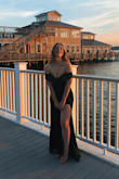 The dress was beyond perfect! It fit like a glove and I not once felt like it was falling down. I was stopped by strangers outside the venue all evening with compliments on the dress. It is a heavier material so certainly not a summer dress. This was a fall wedding on the water so it really was a perfect fit. - Alivia B.