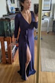 Deep plunge in front but nothing a pin can't fix if you don't want to show cleavage. High slit but only if you move in a certain way. Lots of fabric so covers you up. WAY LONG for my 5'2' shorty self but I'm having it hemmed it's too beautiful to send back. Fabric is soft and a little on the thin side, not see through but you may see panty lines or bra lines...spanx would help I guess. - Jahaira L.