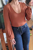 bodysuit is great for pairing with jeans. Just not to excited about the sleeves on this one. Pretty but didn't love so I returned. - Jahaira L.