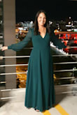 I love this dress. The emerald green was gorgeous and was the perfect choice for me. I purchased it to wear to my cousin's wedding and I received so many compliments! The material is light and flowy. I ordered a size large because I am pear shaped, but I had to have it altered, which I expected. It was taken up at the shoulders and the hem line was taken up a few inches as well. It's a long dress, even with 3 inch heels. The sleeves are so elegant and its overall very flattering. Because the material is so flowy, the bust area is a bit iffy so I had the seamstress put a snap in the front for me, too, which helped. Gorgeous dress for a formal event. You'll love it! - Allison C.