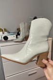 I have been on the hunt for a pair of cute white boots FOREVER and let me tell you I found the perfect pair! I'm glad I read the reviews and sized up. I am a size 10 in shoes, but ordered an 11 and it fits perfect. A size 10 in these boots would not have fit at all, so definitely size up. These boots are so comfortable. I haven't used them out yet but the heel size is perfect enough where it looks tall but is super comfortable to walk around it. Must have!!! - Ariadna F.