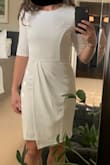 The material is very nice, thicker than expected, providing good coverage. I ordered it in both a size S and M. The small fit but I liked the more relaxed fit of the medium. The top is a little big on me (I'm small chested) but I preferred this over the dress being too snug. Especially since it's on the shorter side for dresses I wear these days:-) I didn't want to feel like I was constantly adjusting it. Overall this dress is really comfortable and I like the coverage from the draping in the front. Excited to wear this for some wedding events this winter! - Kristine J.