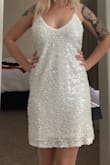 I feel like I'm wearing a bedazzled trash bag. I saw that this item runs large so I ordered XS since I normally wear a small. The XS is still too big and not flattering. - Shylee F.