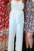 I wore this for my bridal shower and received so many compliments! I usually stay away from strapless but this fit perfectly and stayed up with no issues. The pockets were also a fun addition. I'm short/petite but the length was not an issue on me (especially with heels). Also easy to sit in. - Natalie H.