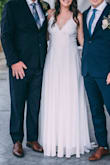 I bought this dress for my wedding dress and it was perfect for the style of wedding we had planned! It fit true to size. It was a tad bit long with my heels on so I did end up getting it hemmed, only a little bit though. If you're thinking of buying this dress do not hesitate! - Tennille P.