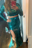 I bought this for my holiday party. I am 5'3" so is a little too long for me. I bought a M and it fit perfectly. - Andrea C.