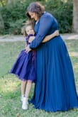 I bought this dress for family portraits and it fit great. It's a little low cut for me so I wore a cami underneath. - Elizabeth S.