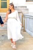 I LOVED THIS DRESS for our engagement pictures! I am wearing a small in this picture! I originally ordered a medium and the top part was HUGE on me. I exchanged for a small and it ended up working. My only other MAJOR complaint is the Zipper is a HASSLE to zip! When it reaches the belted part of the dress under the bust it gets stuck! Therefore making it hard to put on and take off properly! But if you can somehow manage and not get frustrated with the zipper you will love this dress! SIZE DOWN for sure because it runs big! But overall was flowey, not see through, great quality fabric and comfortable! - Celina L.
