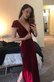 I ordered this dress in red and green, gorgeous material and overall I was in love, but the v neck was way too deep. Deeper than on the model! I have a smaller frame in the shoulders and chest, so even with an XS I think it ran a bit too large and if I were to move much the sleeves would slip right off. I considered altering it because otherwise it is such a pretty dress but decided not to since it seemed it would be a challenge to adjust the top. I would definitely size down a bit if you're smaller in frame in the shoulders. Very sexy and also classy, but I personally don't know where I would flaunt this look!? I would buy this in every color if the V neck was a few inches higher. - Sabrina B.
