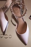 These shoes were perfect for my wedding. The champaign color is a little a little on the pink side as opposed to ivory which I preferred. They survived a full day of walking around and dancing. the heel is low enough to be comfortable for all day wear but still formal. The strip of rhinestones almost came completely off (they are all connected together as a strip, and the strip is held onto the strap of the shoe by some thread?). I can partially blame my rigorous dancing on the breaking though it could have had a more robust hold. I plan on getting them repaired and wearing them again :) - Sabrina B.