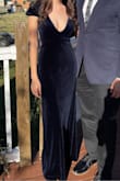 Loved this dress. Very comfortable and easy to move in. I wore an XS. Fabric has some stretch. Just have a plan for the low V neck. I used sticky tape to keep it in place. - Ninah D.