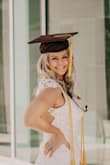 I ordered this dress for my graduation pictures and it fit perfectly! I was between sizes, the small and medium. Medium was too big but small was more snug and fit better overall. The material was so nice and the open back with lace was so pretty! Definitely will be rewearing this dress for more occasions! - Cara O.