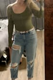 I took the other reviewer's advice and ordered a Large (I'm typically a Medium, 5'9" & 168 Ibs) - glad I did! It fits perfectly. I have a long torso and it doesn't give me a mega wedgie, and the sleeves are long enough. Very flattering with mom jeans! - Amanda F.