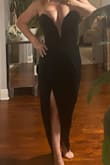 I ordered a size down as I wanted a tapered, fitted look like the model. The dress is beautiful in person and the XS achieved that look perfectly on me. - Domonique M.