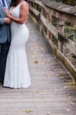 Got married in Vegas and purchased this dress for my wedding photos once we got back home. The fit is awesome and accentuated my figure nicely. The quality is up there with my original wedding dress that I purchased from a national bridal store. I wish it was a tad bit longer for those of us who are on the taller side, but it wasn't a really big deal. I would 100% recommend this dress! - April B.