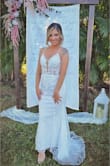 I had to get the bottom hemmed a little bit, but other than that it fit like a glove! I got so many compliments and I felt beautiful on my wedding day!! - Lindsey P.