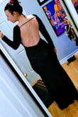 This dress is beautiful, and I feel very sexy in it. I have a 32 G bust so the top is a little awkward with the built in V as it pokes out at the bottom. It could probably be fixed with boob tape. I might try that before I return it. It is also a little long even with heels so it needs to be altered a tiny bit. I'm glad I went with a large though, Meduim would have been too snug to get into. There is no zipper on this dress. - Nicole J.