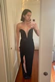 The dress has very little structure and the material is cheap feeling and very thin - not ideal for cool weather. With some boning I think it would have been more flattering or held its shape better. There was also a strange bundle of material in the front waistline area and that was not flattering. - Dara V.
