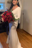 I absolutely loved this dress on my wedding day, however when I first tried it on you definitely had to trust the process with alterations. I think they purposefully make the sleeves pretty long. Also for me personally the bottom half fit great right out of the box, however the top was very big The bust, chest, arms were all way to big. However after altering the fit perfectly. This dress is also very easy to alter, if you have a basic sewing machine you can do it yourself. Also the material is very stretchy so it is forgiving. I altered the sleeves where they would be tight due to just my personal preference. I also added a jewel belt which i think added a little extra bling. I did have to get double sided tape the keep the shoulders on after alterations due slippage. Such an elegant and simple dress. Everyone thought it was a very expensive dress. - Sara R.