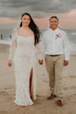 I ordered this dress last minute the week before we decided to cancel our big ceremony and have an intimate ceremony. This dress was beautiful! Would've loved for it to be a little more fitting around the waist, but nonetheless it was gorgeous for our beach ceremony. - Kiana R.