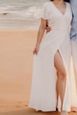 I wore this dress for a beach photo shooting, and I loved it. I received lots of compliments. I usually wear size XS, and it was a perfect fit. It was too long, so I had to have it shortened, but other than that, it was perfect. Highly recommend this dress! - Rita S.