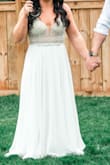 Bought this dress to wear at my wedding reception but then covid ruined our plans, we ended up having a small ceremony in our backyard so I wore this as my wedding dress. It fit perfectly and photographed so well that I brought it on our honeymoon/anniversary trip and wore it a second time for beach photos! I did need to have it hemmed because i wanted to wear flats but it was a minor alteration that was inexpensive. Highly recommend! - Chelsea C.