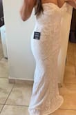 I loved the dress! Looks expensive and elegant. Very well made (I'm picky!). Like others said, the only downside is it runs small on the upper back. I ordered a medium. I'm 5'6", 140", curvy. Will take it to convert it to corset so it will fit better. - Lymari D.