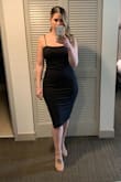 I LOVE this dress. I originally ordered (3) that I needed to exchange for size and they were out of stock and found this one instead. I'm so happy I got it. It hugs you in all the right places, the slit is so nice but not too much and the back gold zipper is a perfect detail! I wore it to a wedding and got compliments all night! It was very comfy and didn't rise up at all throughout the night. Highly recommend! - Kathleen N.