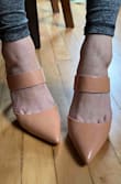 Love this style and have had my eye on it for a long time as I wanted a non-suede nude mule. The shoe fits perfectly and is not too high, but I docked a star because the color pulls more peach to me than a true nude. Not a deal-breaker as I will still keep them, but not exactly what I was hoping for either. I am usually a 6.5 or 7 in shoes, but I have been consistently 6.5 in Lulus brand so ordered as such. As somebody with wider feet, the band is not tight and the toe box is of good fit too. Hope this review helps! - Stephanie S.