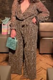 This jumpsuit was a hit at the party I went to. Got so many compliments. I ordered a large so the bust size was slightly loose but I loved it anyway! Highly recommend it for a fun event. - Leilani S.