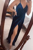 This dress is super flattering for those who want to hide a little tummy! The material is very thick and heavy so it doesn't cling to every lump and bump. I typically wear a large and the medium fit with a little extra wiggle room so I would recommend to size down! This dress is a winner in my book! - Kaylan P.