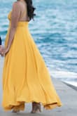 I wore this dress for my engagement photo shoot and it was absolutely beautiful! I did have to alter the top because it was a bit loose up top but if I bought a small, I think it would have been tight on my hips. I wore a 2.5 inch heel with this dress so i didn't have to hem the bottom. - Jenny K.