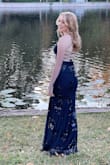 We ordered this dress last minute for my daughters Senior Year pictures. The dress was perfect for what we wanted. Simple and elegant with just enough sparkle. The back of this dress is beyond gorgeous! - Shannon B.