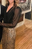 I loved this bodysuit - I typically stay away from them since they don't seem practical but I will definitely be wearing this a lot, I got SO many compliments!! It's perfect for jazzing up any outfit and adding some intrigue, especially with the subtle dot pattern and there's added structure and oomph on the shoulders.
As someone with a long torso (5'9"), I was worried it would ride up but I had zero issues, it's a great length that I think could work for several heights. The bottom snaps/unsnaps so you don't need to fully de-robe for bathroom breaks. - Kaitlin O.