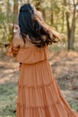 I wore this dress to my baby's first photoshoot. I got a small and it fit perfect. Super comfortable. Stayed in place. Color is as on the site. - Thresha P.