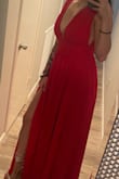 Bought this for a wedding and it was perfect! I'm usually a medium, but ordered a small and I'm so glad I did. I think unless you're very busty the straps might fall a bit. If you don't wanna size down you could just alter the straps your self and it would be fine. The slit came up high enough to be really sexy, but not trashy. - Justine M.